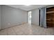 Bright bedroom with tile floors, closet and natural light at 10125 Cherry Creek Ln, Port Richey, FL 34668