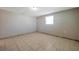 Bright bedroom featuring tile flooring and a window for natural light at 10125 Cherry Creek Ln, Port Richey, FL 34668