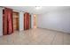 A spacious bedroom with tile flooring and closet space at 10125 Cherry Creek Ln, Port Richey, FL 34668