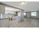 Open concept: functional kitchen and spacious living area with tile floors at 10125 Cherry Creek Ln, Port Richey, FL 34668