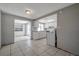 Functional kitchen with white cabinetry and adjacent dining area at 10125 Cherry Creek Ln, Port Richey, FL 34668