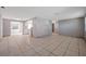 Spacious living room with tile flooring and ample natural light at 10125 Cherry Creek Ln, Port Richey, FL 34668