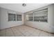 Bright room with tile flooring and two windows for natural light at 10125 Cherry Creek Ln, Port Richey, FL 34668