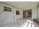 A versatile sunroom with windows and sliding door offers space for relaxation or entertaining at 10125 Cherry Creek Ln, Port Richey, FL 34668
