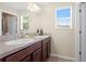 Bathroom featuring double sinks, and a large mirror at 10216 Summer Azure Dr, Riverview, FL 33578