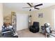 This bedroom has a ceiling fan, large closet and chair at 10216 Summer Azure Dr, Riverview, FL 33578