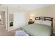This bedroom features a comfy bed, closet with a mirror and a side table at 10216 Summer Azure Dr, Riverview, FL 33578