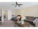 Spacious living room with sofa, decor, and doorway to the next room at 10216 Summer Azure Dr, Riverview, FL 33578