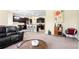 Open-concept living room showcasing a modern kitchen, seating area, and stylish furnishings at 10216 Summer Azure Dr, Riverview, FL 33578