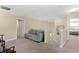 Spacious loft area with comfortable seating and a staircase at 10216 Summer Azure Dr, Riverview, FL 33578