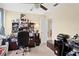 Office space with full desk, shelves with pictures, and a ceiling fan at 10216 Summer Azure Dr, Riverview, FL 33578