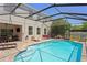 Spacious pool with brick paver decking, screened enclosure, and outdoor furniture at 10216 Summer Azure Dr, Riverview, FL 33578