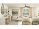 Bright living room offers a comfortable seating area, natural lighting and modern decor at 10334 Gentle Rain Dr, Land O Lakes, FL 34638