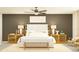 Cozy main bedroom showcasing a platform bed, stylish nightstands, lamps and an art piece at 10334 Gentle Rain Dr, Land O Lakes, FL 34638