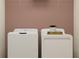 Efficient laundry room with a modern washer and dryer at 10857 Rustic Eve Ct, Land O Lakes, FL 34638