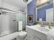 Cozy bathroom with tiled walls, shower with glass door, and single sink vanity at 1125 83Rd N Ave # D, St Petersburg, FL 33702