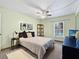 Well-lit bedroom with a ceiling fan and carpeted floors, offering a comfortable retreat at 1125 83Rd N Ave # D, St Petersburg, FL 33702
