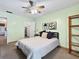 Cozy bedroom with ceiling fan, natural light, and neutral tones for a serene feel at 1125 83Rd N Ave # D, St Petersburg, FL 33702