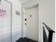 Hallway featuring a white door and dark trim at 1125 83Rd N Ave # D, St Petersburg, FL 33702
