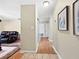 Hallway with wood and tile floors leading to living area at 1125 83Rd N Ave # D, St Petersburg, FL 33702