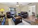 Cozy living room with ceiling fan, leading to an outdoor patio with seating at 1125 83Rd N Ave # D, St Petersburg, FL 33702