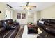 Inviting living room featuring ceiling fan, comfortable seating and neutral decor at 1125 83Rd N Ave # D, St Petersburg, FL 33702