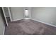 Spacious bedroom with neutral paint, carpet, and views of the adjoining bathroom at 11341 Durham St, Parrish, FL 34219