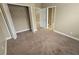 Neutral bedroom with carpet, closet and bathroom access at 11341 Durham St, Parrish, FL 34219