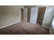 Cozy bedroom with neutral paint, carpeting, and a walk-in closet at 11341 Durham St, Parrish, FL 34219