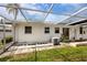 This home features a screened-in lanai, perfect for enjoying the Florida weather in comfort with a white rock garden at 12400 Park Blvd # 417, Seminole, FL 33772