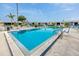 Large community pool with lounge chairs and tables, perfect for relaxation and socializing in this community at 12400 Park Blvd # 417, Seminole, FL 33772
