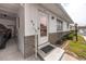 Home exterior featuring a front door, covered parking, and a landscaped yard at 12400 Park Blvd # 417, Seminole, FL 33772