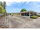 A community building featuring outdoor drying lines, screened porch and adjacent paved surface at 12400 Park Blvd # 417, Seminole, FL 33772