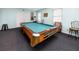 Enjoy a game of pool in this relaxing room with a billiard table and comfortable seating at 12400 Park Blvd # 417, Seminole, FL 33772