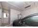 Garage interior features a car, storage, and access to an enclosed porch at 12400 Park Blvd # 417, Seminole, FL 33772