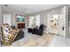 Cozy living room featuring comfortable seating, natural light, and tile flooring at 12400 Park Blvd # 417, Seminole, FL 33772