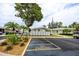 Designated parking area with well-maintained landscaping, and easy access to community mailboxes and residential units at 12400 Park Blvd # 417, Seminole, FL 33772