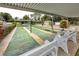 Community shuffleboard courts with shaded seating, providing a relaxing spot for residents to enjoy outdoor recreation at 12400 Park Blvd # 417, Seminole, FL 33772