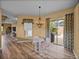 Charming breakfast nook with stylish accents and seamless access to the outdoors at 12413 Woodlands Cir, Dade City, FL 33525