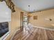 Cozy breakfast nook features stylish lighting and easy access to the outdoor lanai at 12413 Woodlands Cir, Dade City, FL 33525