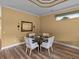 Dining area featuring a round table, comfortable seating, and stylish decor, perfect for Gathering meals at 12413 Woodlands Cir, Dade City, FL 33525