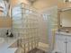 Tiled glass block shower with modern fixtures and finishes, next to soaking tub at 12413 Woodlands Cir, Dade City, FL 33525