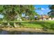 Spacious backyard with fire pit and easy access to the lake at 1313 Oxbridge Dr, Lutz, FL 33549