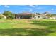 Large screened-in patio in a spacious backyard at 1313 Oxbridge Dr, Lutz, FL 33549