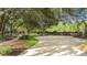 Community park with walking path and mature shade trees at 1313 Oxbridge Dr, Lutz, FL 33549