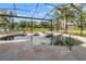 Outdoor pool area with a spa, and spacious backyard views at 1313 Oxbridge Dr, Lutz, FL 33549