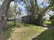 Fenced backyard featuring a screened in pool and verdant landscaping at 15024 Eaglepark Pl, Lithia, FL 33547