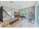 Bright exercise room with home gym equipment, TV, and neutral color scheme at 15024 Eaglepark Pl, Lithia, FL 33547