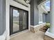 Elegant front door with decorative glass and stonework details enhancing the home's entrance at 15024 Eaglepark Pl, Lithia, FL 33547