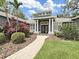 Inviting front entrance with manicured landscaping and a well-lit walkway leading to the home at 15024 Eaglepark Pl, Lithia, FL 33547